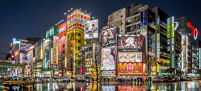 Akihabara Crossing at night, lit up with anime posters